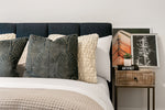 With a frame constructed from rubber wood and plywood, this bed features a headboard upholstered in a blue fabric with channeling. Solid rubber wood legs and an exposed wooden frame in a walnut finish complete the look. A box spring is not required for this bed.